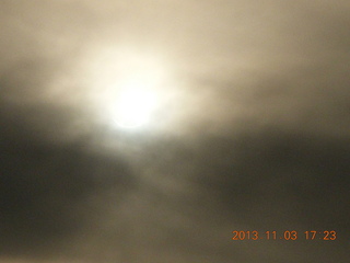 187 8f3. Uganda - eclipse site - sun behind clouds