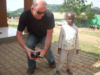 84 8f4. Uganda - drive to chimpanzee park - lunch - Nick and a kid