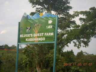 Uganda - farm resort run - sign for resort from main road