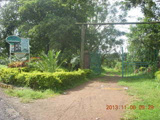 Uganda - Tooro Botanical Garden sign and gate