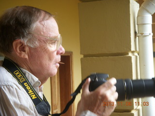 139 8f6. Uganda - Mountain of the Moon hotel - Bill S taking a picture of birds