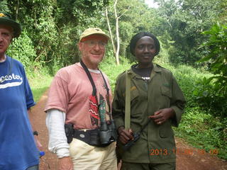 231 8f6. Uganda - Primate Lodge Kabile chimpanzee park - Adam and guide