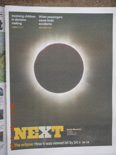 25 8f7. Uganda - drive back to Kampala - Daily Monitor newspaper on the eclipse