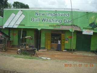 37 8f7. Uganda - drive back to Kampala - New Improved Bull Washing sign - New improved Bull Washing Bar
