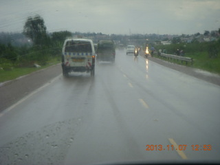 48 8f7. Uganda - drive back to Kampala - rain