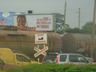 61 8f7. Uganda - Kampala - chicken billboard and railroad crossing