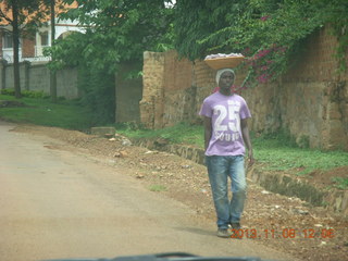 Uganda - Entebbe - drive to Protea Hotel - woman balancing basket on head