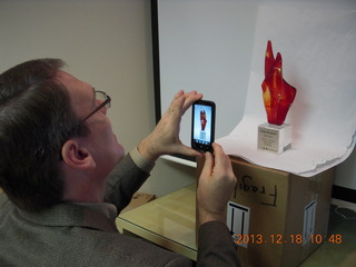Jim S taking a picture of the Arizona Innovation Challenge award
