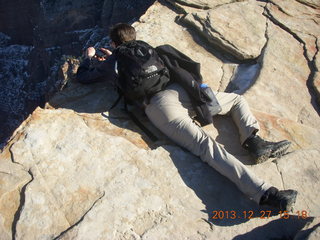 Zion National Park - Angels Landing hike - Brian leaning over taking a picture at the top