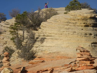 224 8gt. Zion National Park - Angels Landing hike - hiker waving at the top