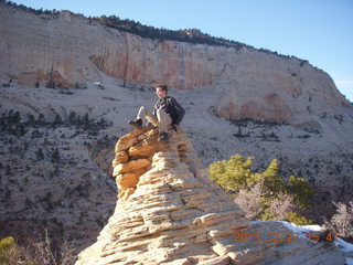 239 8gt. Zion National Park - Angels Landing hike - at the top - Brian sitting on a hill