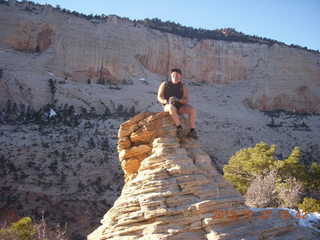 243 8gt. Zion National Park - Angels Landing hike - at the top - Adam sitting on a hill
