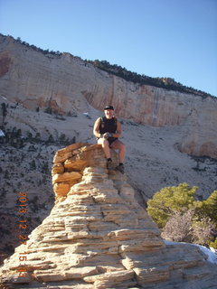244 8gt. Zion National Park - Angels Landing hike - at the top - Adam sitting on a hill