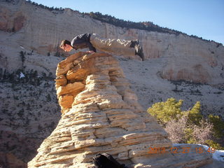 258 8gt. Zion National Park - Angels Landing hike - at the top - Brian balanced on a hill