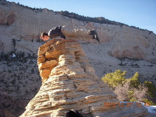 259 8gt. Zion National Park - Angels Landing hike - at the top - Brian balanced on a hill