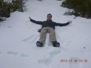 21 8gu. Zion National Park - Cable Mountain hike - Brian making a snow angel
