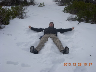 23 8gu. Zion National Park - Cable Mountain hike - Brian making a snow angel