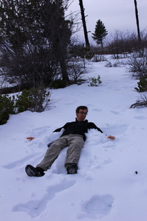 228 8gu. Zion National Park - Cable Mountain hike - Brian making a snow angel