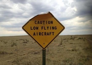 Caution Low Flying Aircraft sign