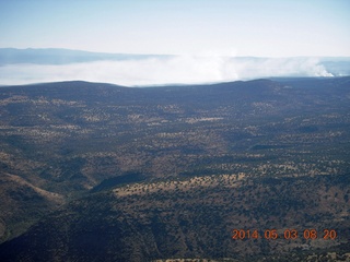 128 8m3. aerial - flying to Double Circle Ranch - smoke from fires