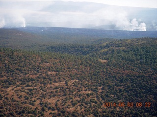 129 8m3. aerial - flying to Double Circle Ranch - smoke from fires