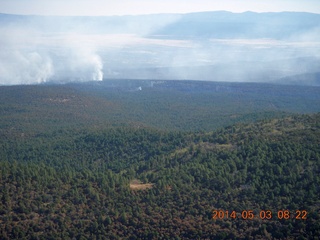 130 8m3. aerial - flying to Double Circle Ranch - smoke from fires