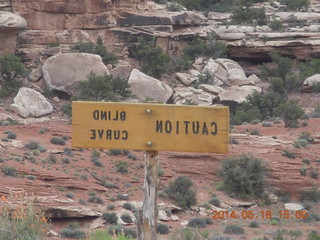377 8mj. Canyonlands National Park - Needles - Elephant Hill drive - blind curve sign in reverse