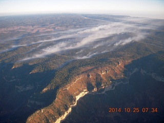 aerial - Grand Canyon just after dawn - low clouds on the north rim