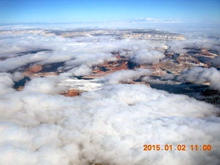 aerial - clouds over snowy desert