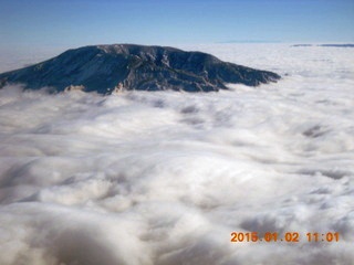 aerial - Navajo Mountain in clouds