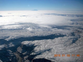 29 8v2. aerial - snow and clouds and canyon