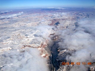 aerial - snow and clouds and canyon - Colorado River