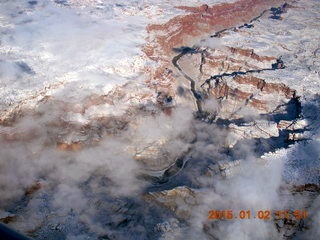 31 8v2. aerial - snow and clouds and canyon - Colorado River