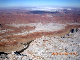 40 8v2. aerial - snow and clouds and canyon - Confluence of Green and Colorado River