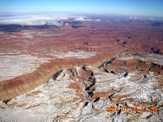 aerial - snow and clouds and canyonlands