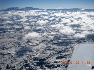 43 8v2. aerial - snow and clouds and canyonlands