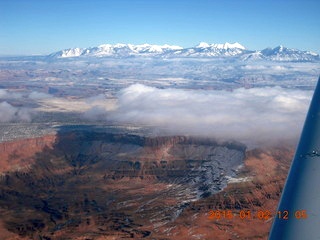 aerial - snowy canyonlands with some clouds
