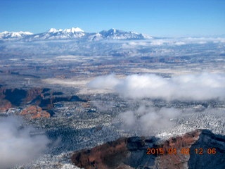 aerial - snowy canyonlands with clouds