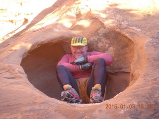 137 8v3. Arches National Park - Devils Garden hike - Adam in hole in the rock - tripod and timer
