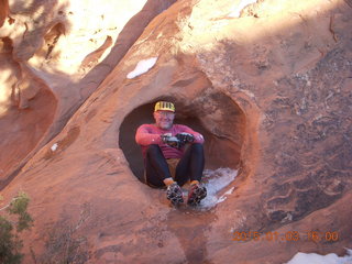 143 8v3. Arches National Park - Devils Garden hike - Adam in hole in the rock
