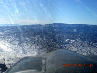 181 8v6. aerial - snowy Utah landscape - high mountains ahead