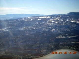 187 8v6. aerial - snowy Utah landscape - high mountains ahead