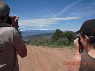 106 8zw. drive to Calamity Mine - Shaun and Karen both taking a picture of the LaSalle Mountains