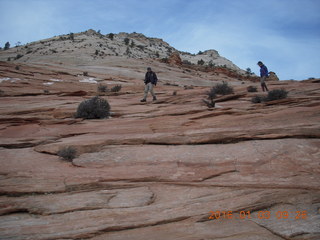 44 973. Zion National Park - layered slickrock - people