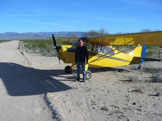 Laura flying N8377W at Alamo Lake