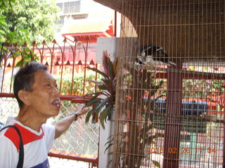 70 98s. Bangkok - Phisit's place - Phisit and bird