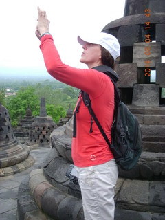 99 994. Indonesia - Borobudur temple - woman taking a picture