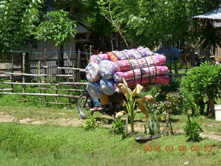 133 998. Indonesia village - rider with big load