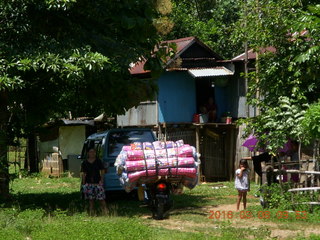 134 998. Indonesia village - rider with big load