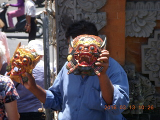 184 99d. Indonesia - Bali - temple at Klungkung - guy selling masks